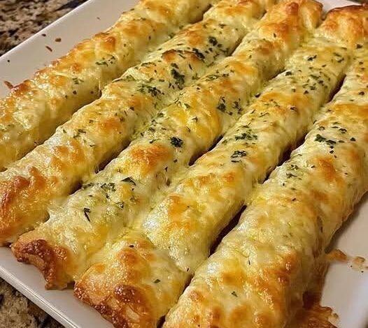 Cheese-Loaded Garlic Breadsticks FB IMG 1766100350978